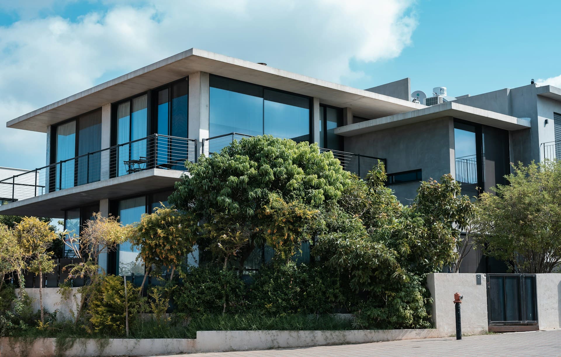 Contemporary white villa with glass balconies